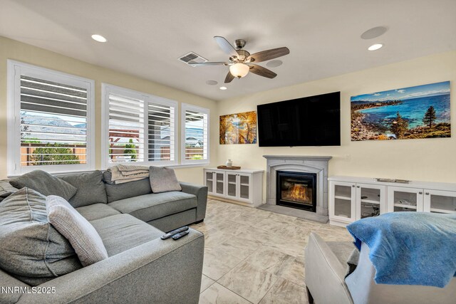 2222 Nasrullah Ln, Reno, NV 89521 - living area with ceiling fan, a premium fireplace, and recessed lighting
