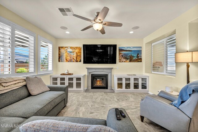 2222 Nasrullah Ln, Reno, NV 89521 - living room featuring ceiling fan, a glass covered fireplace, and recessed lighting