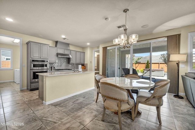 2222 Nasrullah Ln, Reno, NV 89521 - dining area featuring a chandelier and recessed lighting