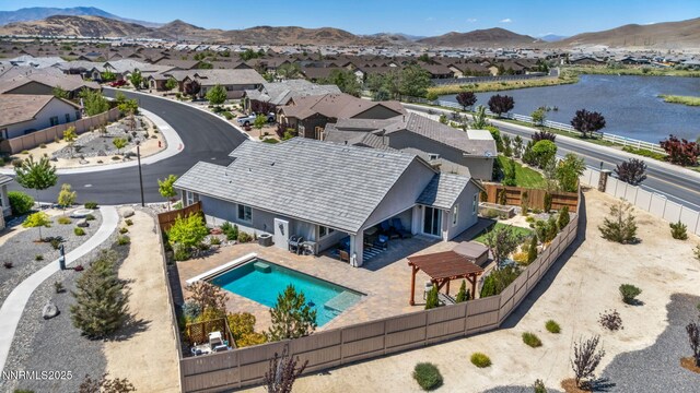 2222 Nasrullah Ln, Reno, NV 89521 - aerial view of residential area with a water and mountain view and a pool