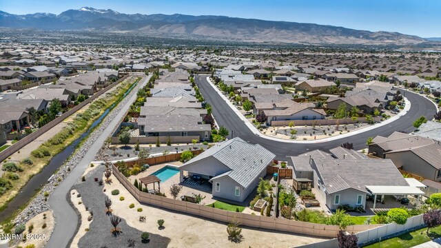 2222 Nasrullah Ln, Reno, NV 89521 - aerial perspective of suburban area with mountains and a pool