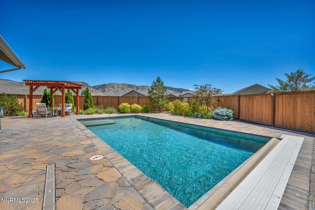 2222 Nasrullah Ln, Reno, NV 89521 - view of pool featuring a pergola, a fenced backyard, a patio, and a mountain view