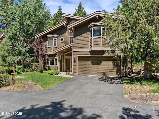 275 Deer Ct, Incline Village, NV 89451 - view of front of house featuring driveway, a garage, and a front yard