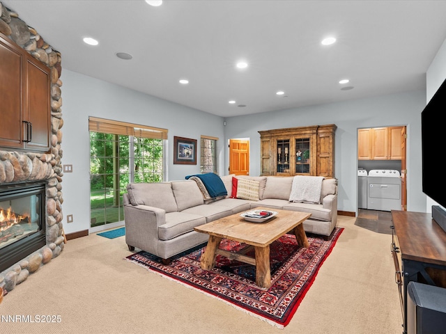 275 Deer Ct, Incline Village, NV 89451 - living area with washer and clothes dryer, light carpet, a stone fireplace, and recessed lighting
