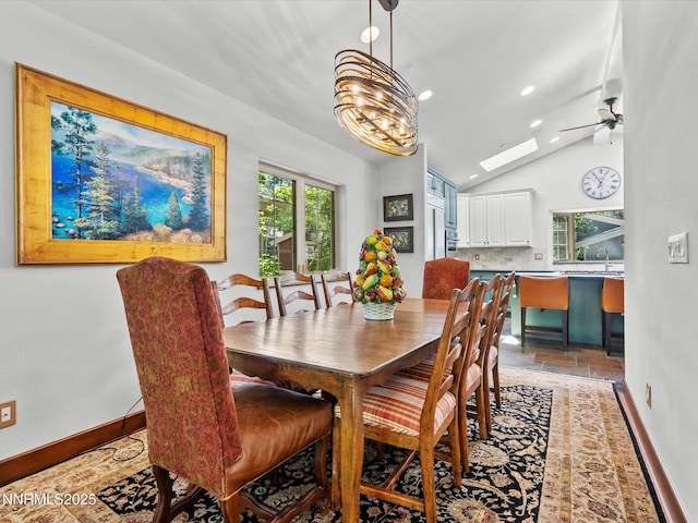 275 Deer Ct, Incline Village, NV 89451 - dining room with lofted ceiling, ceiling fan, light stone finish floors, recessed lighting, and a skylight