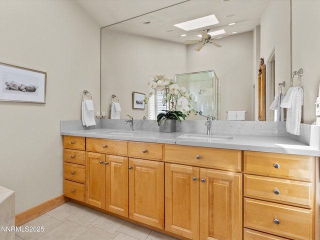 275 Deer Ct, Incline Village, NV 89451 - full bath with a skylight, double vanity, tile patterned floors, and a ceiling fan