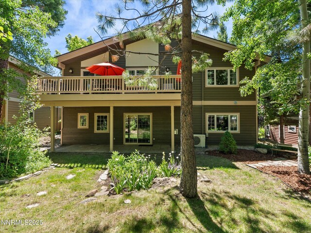 275 Deer Ct, Incline Village, NV 89451 - back of property featuring a lawn, a deck, and a patio