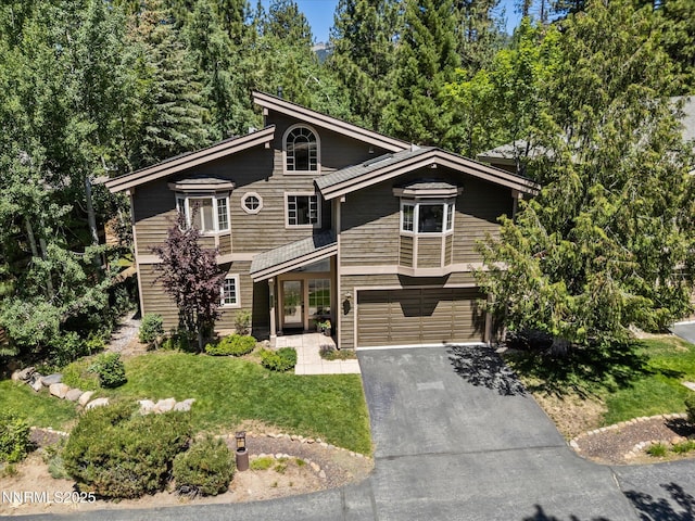 275 Deer Ct, Incline Village, NV 89451 - view of front of house with driveway, a front lawn, and a garage