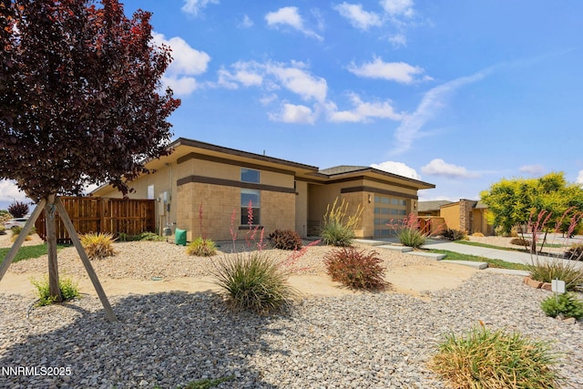 698 Raptor Way, Fernley, NV 89408 - view of front of home with a garage and concrete block siding