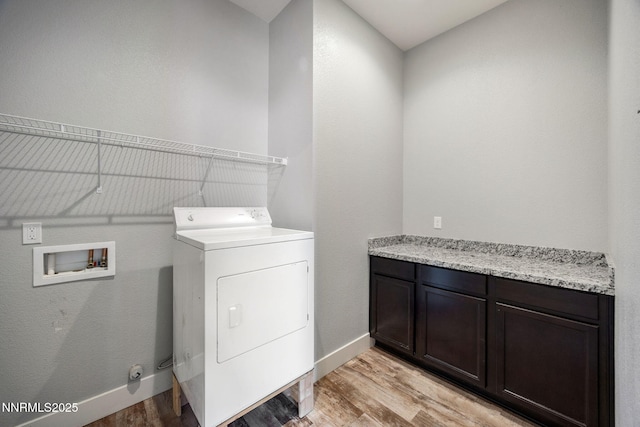 698 Raptor Way, Fernley, NV 89408 - laundry room featuring washer / dryer, light wood-style flooring, and cabinet space