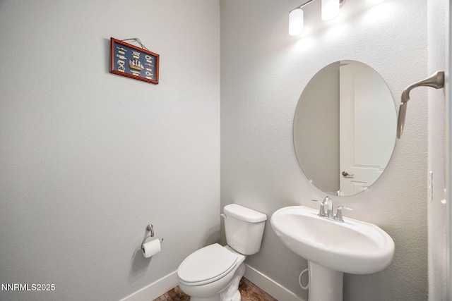 698 Raptor Way, Fernley, NV 89408 - half bathroom with toilet and wood finished floors