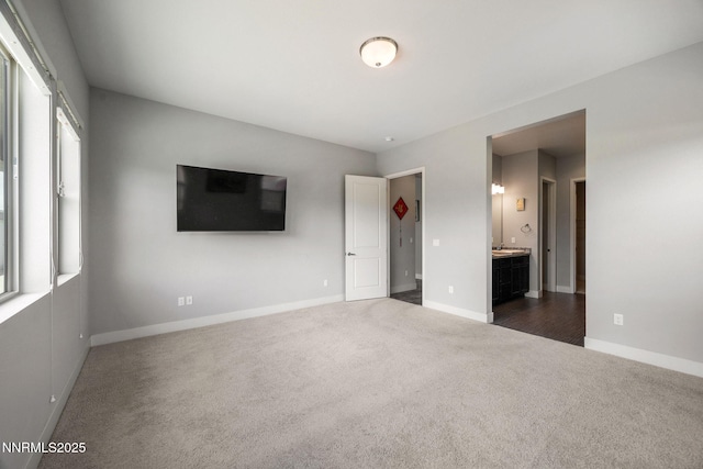 698 Raptor Way, Fernley, NV 89408 - unfurnished bedroom featuring carpet flooring and connected bathroom