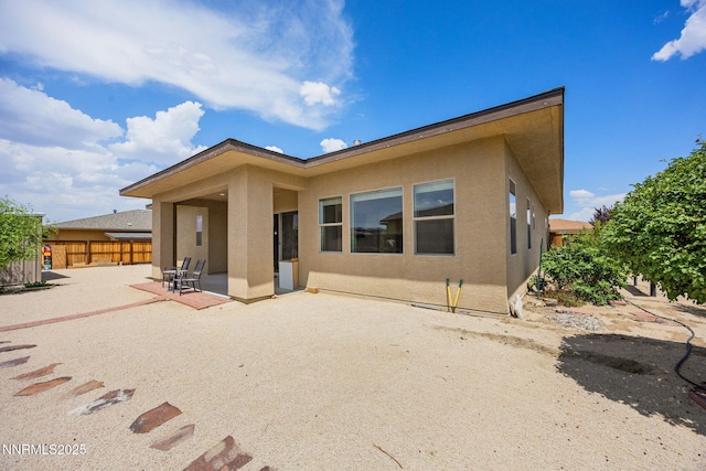 698 Raptor Way, Fernley, NV 89408 - rear view of property with stucco siding and a patio