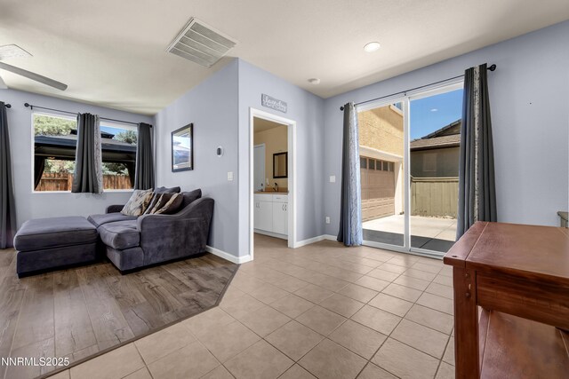 10509 Yuba Ct, Reno, NV 89521 - living room featuring light tile patterned flooring and baseboards