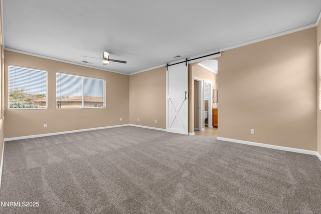 10509 Yuba Ct, Reno, NV 89521 - carpeted spare room with crown molding, a barn door, and a ceiling fan