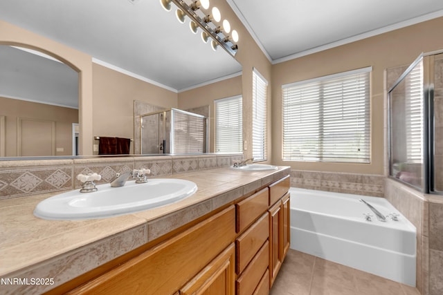 10509 Yuba Ct, Reno, NV 89521 - full bathroom featuring tile patterned flooring, double vanity, a shower stall, a garden tub, and ornamental molding