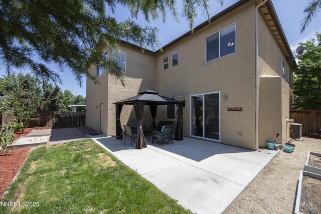 10509 Yuba Ct, Reno, NV 89521 - rear view of property with a gazebo, stucco siding, a patio, and a fenced backyard