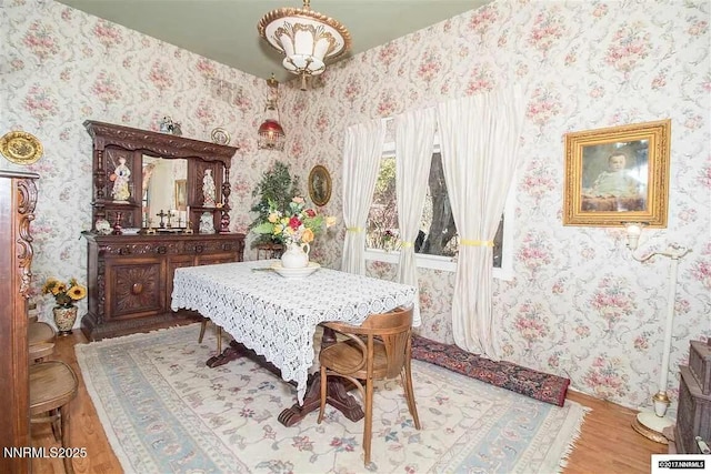 1016 S C St, Virginia City, NV 89440 - dining area featuring wallpapered walls and wood finished floors