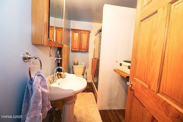 1016 S C St, Virginia City, NV 89440 - full bath with a shower stall and wood finished floors