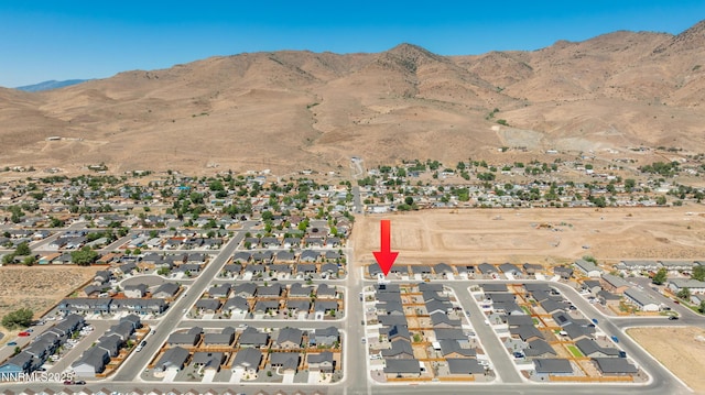 102 Halite Dr, Dayton, NV 89403 - aerial overview of property's location with a mountain backdrop and nearby suburban area