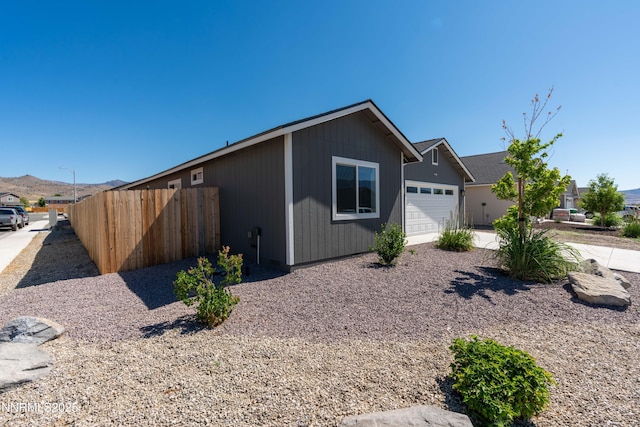 102 Halite Dr, Dayton, NV 89403 - view of front of property with a garage and a mountain view