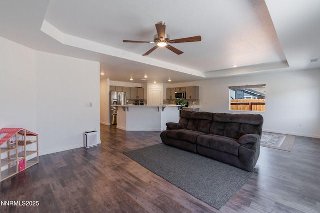 102 Halite Dr, Dayton, NV 89403 - living room featuring a tray ceiling, ceiling fan, dark wood-type flooring, and recessed lighting