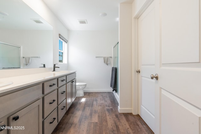 102 Halite Dr, Dayton, NV 89403 - bathroom with wood finished floors, double vanity, and a shower with door