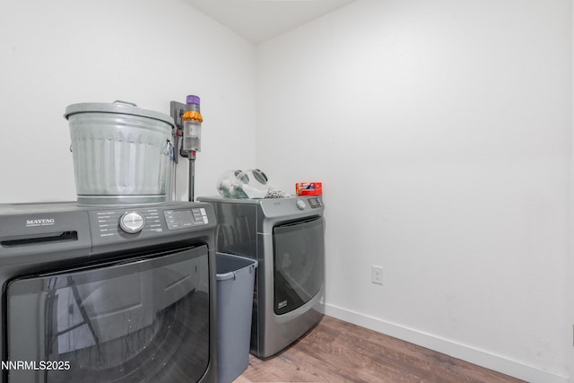 102 Halite Dr, Dayton, NV 89403 - laundry area featuring washing machine and dryer and wood finished floors