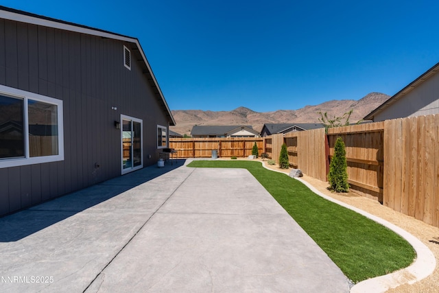 102 Halite Dr, Dayton, NV 89403 - fenced backyard featuring a mountain view and a patio