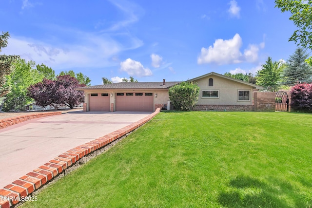 1401 Jefferson Dr, Carson City, NV 89706 - ranch-style house with an attached garage, driveway, a front lawn, and stucco siding