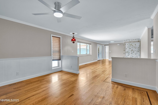 1401 Jefferson Dr, Carson City, NV 89706 - spare room featuring ornamental molding, light wood-style flooring, a wainscoted wall, and ceiling fan