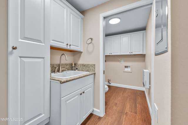 1401 Jefferson Dr, Carson City, NV 89706 - laundry room with hookup for a washing machine, cabinet space, and wood finished floors