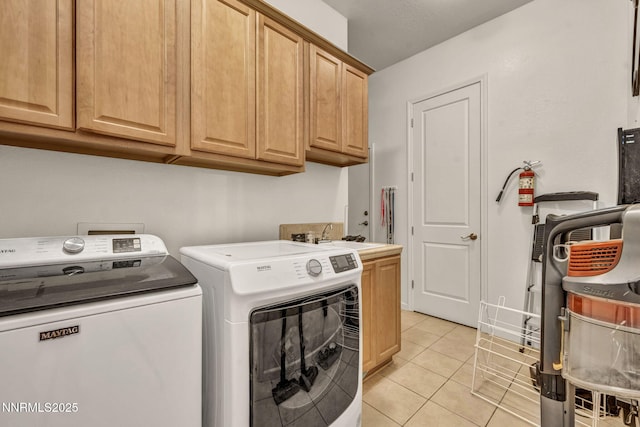 9900 Wilbur May Pkwy Apt 5102, Reno, NV 89521 - laundry room featuring washing machine and dryer, cabinet space, and light tile patterned floors
