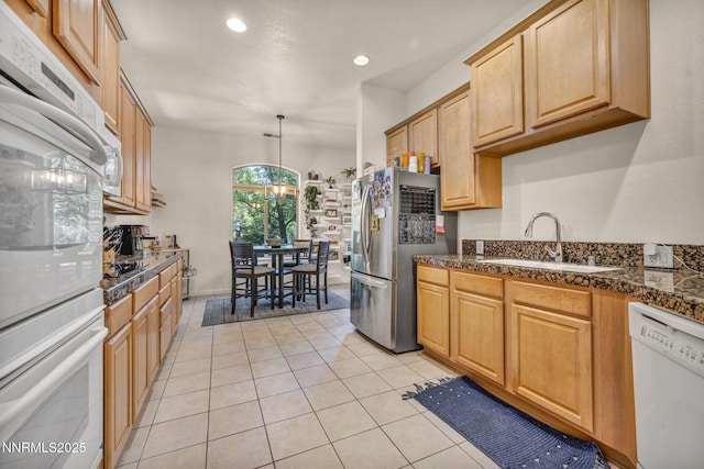 9900 Wilbur May Pkwy Apt 5102, Reno, NV 89521 - kitchen with white appliances, recessed lighting, light tile patterned floors, tile countertops, and decorative light fixtures
