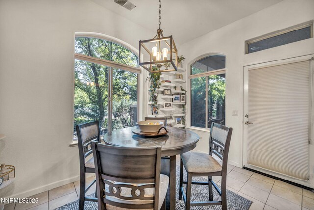 9900 Wilbur May Pkwy Apt 5102, Reno, NV 89521 - dining area with light tile patterned floors and a chandelier