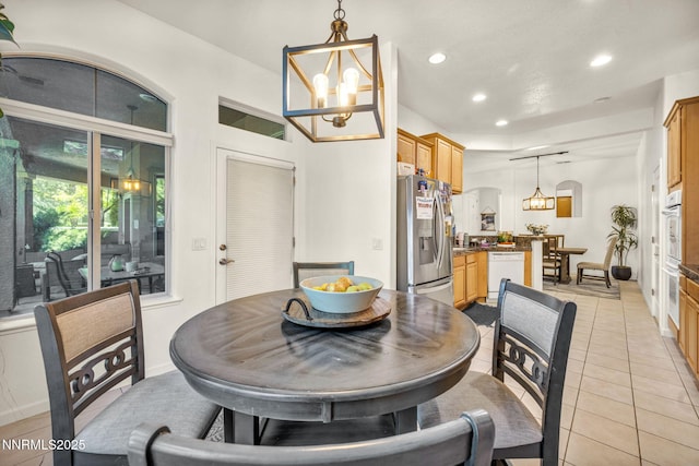 9900 Wilbur May Pkwy Apt 5102, Reno, NV 89521 - dining space featuring a chandelier, recessed lighting, and light tile patterned floors