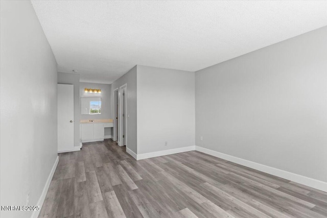 2090 Highview Ct Unit 7, Reno, NV 89512 - unfurnished room featuring wood finished floors and a textured ceiling