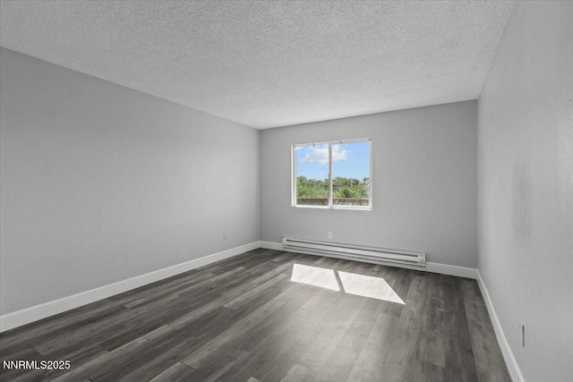 2090 Highview Ct Unit 7, Reno, NV 89512 - spare room featuring a baseboard heating unit, dark wood-style floors, and a textured ceiling