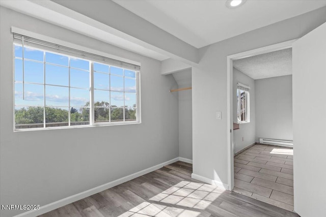 2090 Highview Ct Unit 7, Reno, NV 89512 - spare room with baseboard heating and wood finished floors