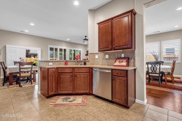4883 Brunello Dr, Sparks, NV 89436 - kitchen with dishwasher, a ceiling fan, decorative backsplash, recessed lighting, and light stone countertops