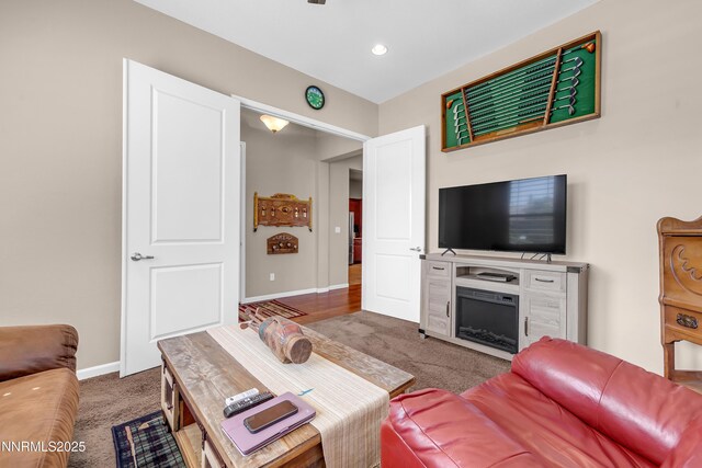 4883 Brunello Dr, Sparks, NV 89436 - carpeted living area featuring a fireplace and recessed lighting