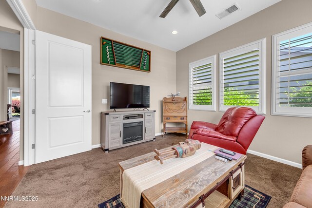 4883 Brunello Dr, Sparks, NV 89436 - carpeted living area with a ceiling fan, recessed lighting, and a fireplace