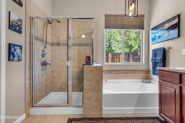 4883 Brunello Dr, Sparks, NV 89436 - bathroom featuring a garden tub, a stall shower, vanity, and tile patterned flooring