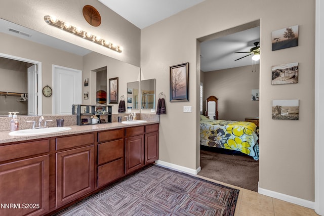 4883 Brunello Dr, Sparks, NV 89436 - ensuite bathroom with double vanity, a ceiling fan, and tile patterned floors