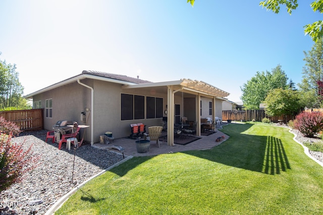 4883 Brunello Dr, Sparks, NV 89436 - rear view of house featuring stucco siding, a fenced backyard, and a patio