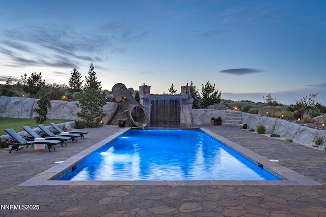 5427 Salmon River Ct, Reno, NV 89511 - pool at dusk featuring a patio area