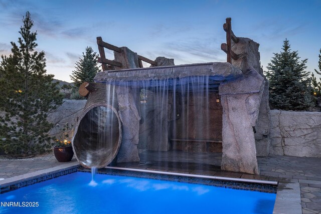 5427 Salmon River Ct, Reno, NV 89511 - pool at dusk with an outdoor pool