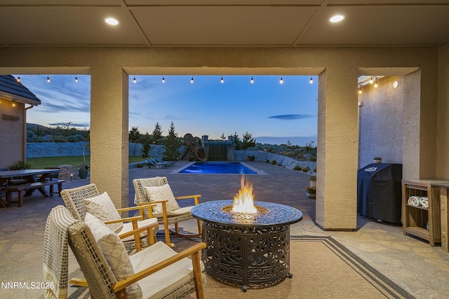 5427 Salmon River Ct, Reno, NV 89511 - view of patio featuring an outdoor fire pit and a grill