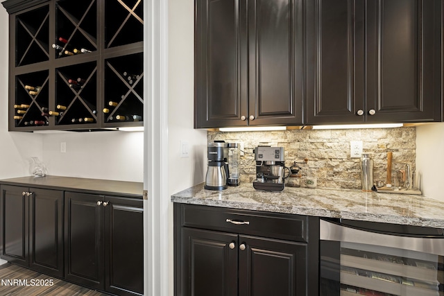 5427 Salmon River Ct, Reno, NV 89511 - indoor dry bar featuring beverage cooler, tasteful backsplash, and wood finished floors