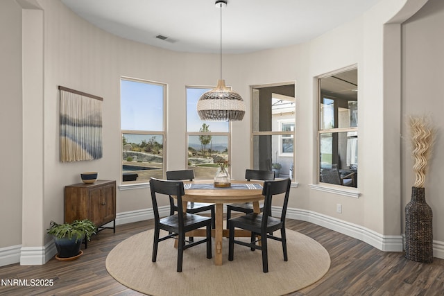 5427 Salmon River Ct, Reno, NV 89511 - dining area featuring dark wood finished floors and baseboards
